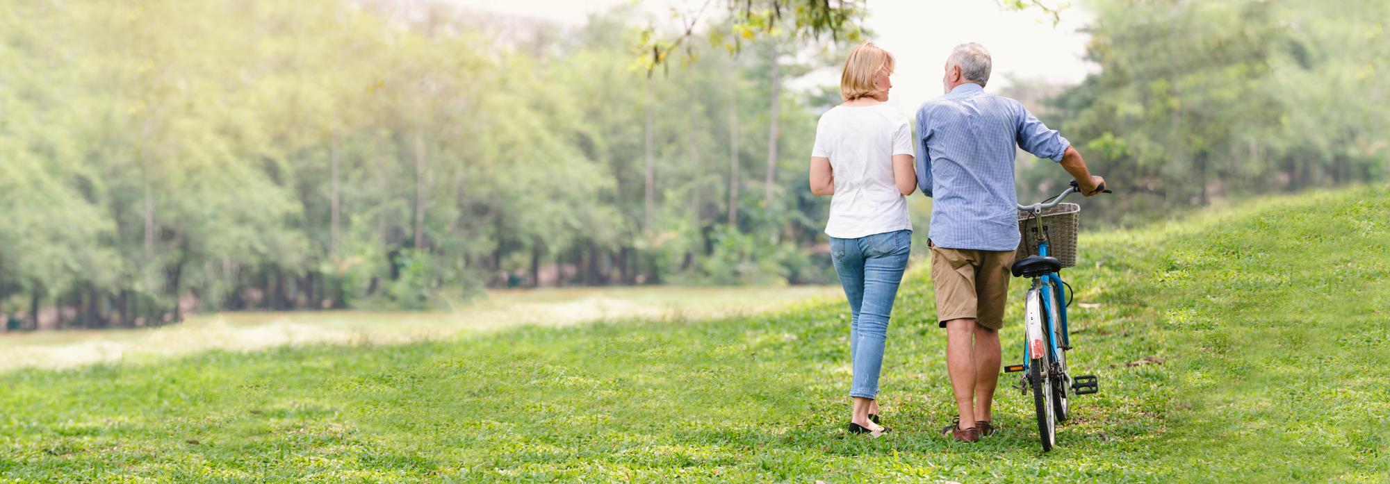 couple walking with a bicycle